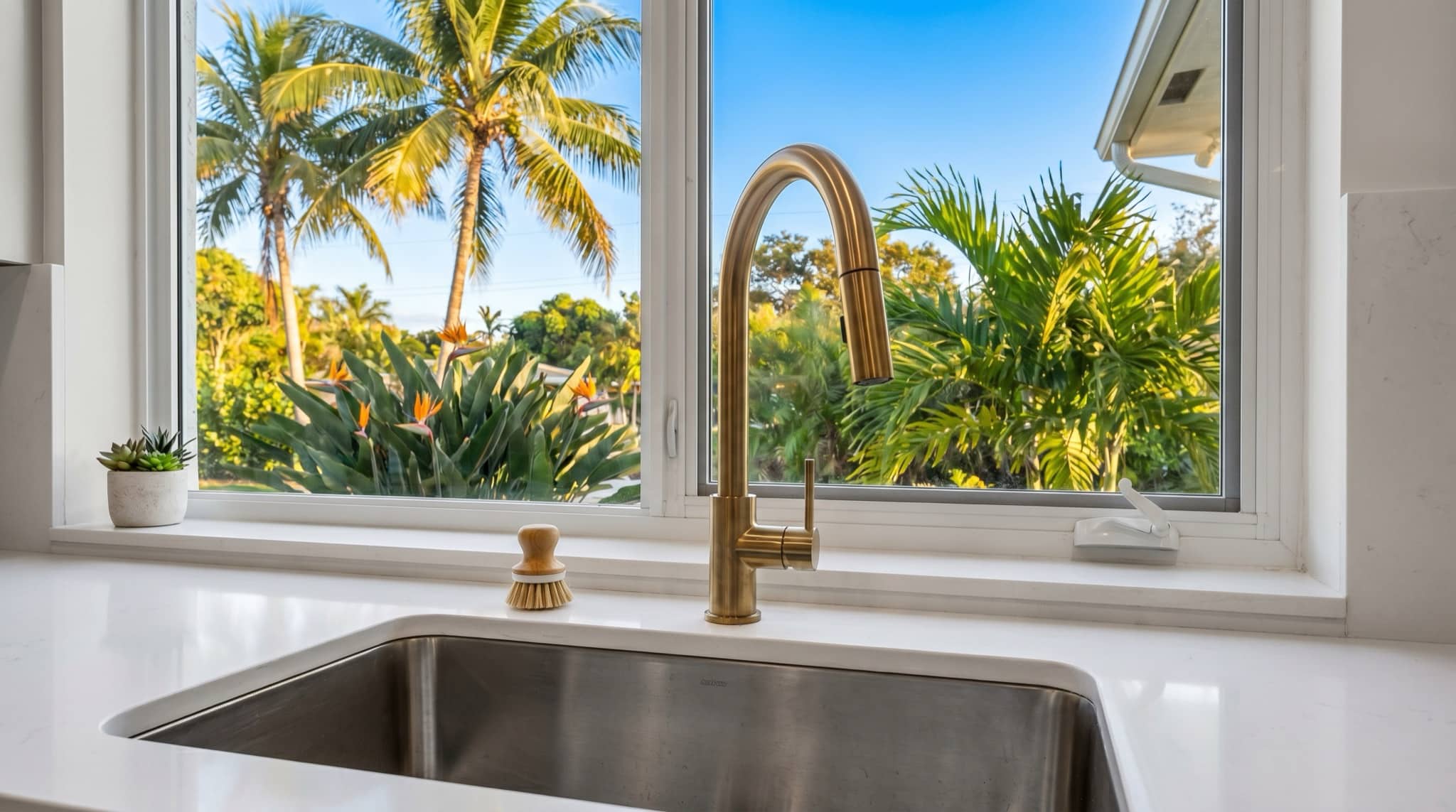 Modern kitchen sink and faucet detail in a Florida kitchen, South Florida.